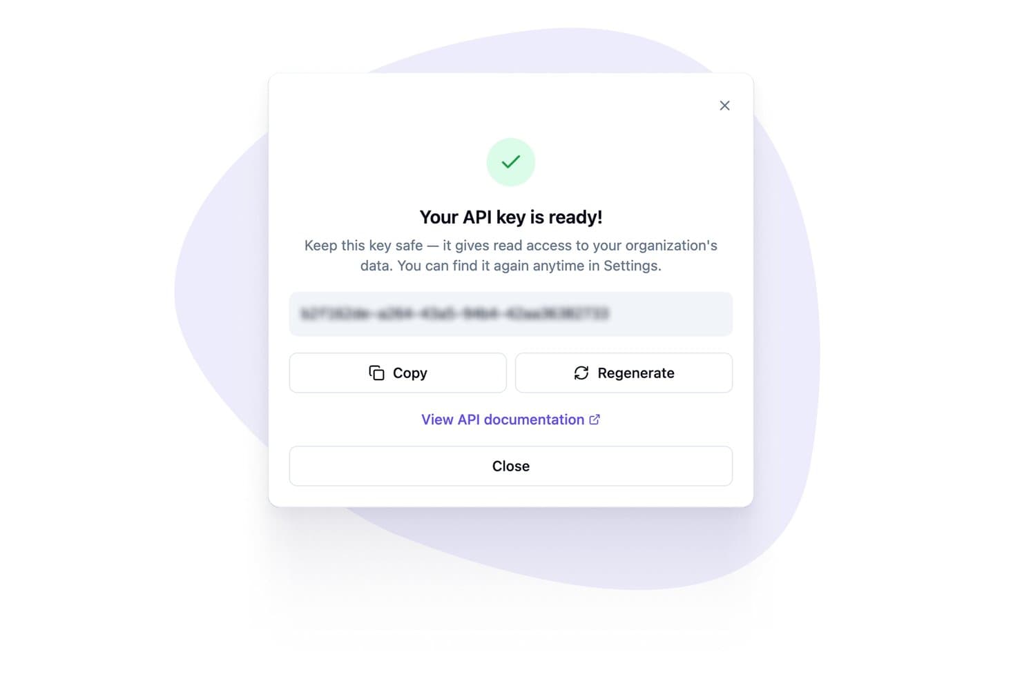 Modal dialog showing a ready API key with Copy and Regenerate buttons.