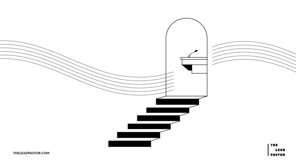 stairs leading up to an archway with a podium inside