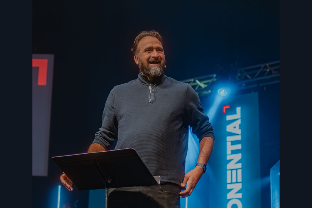 Jay Pathak, Senior Pastor of Mile High Vineyard, speaking at the Exponential Conference 2025